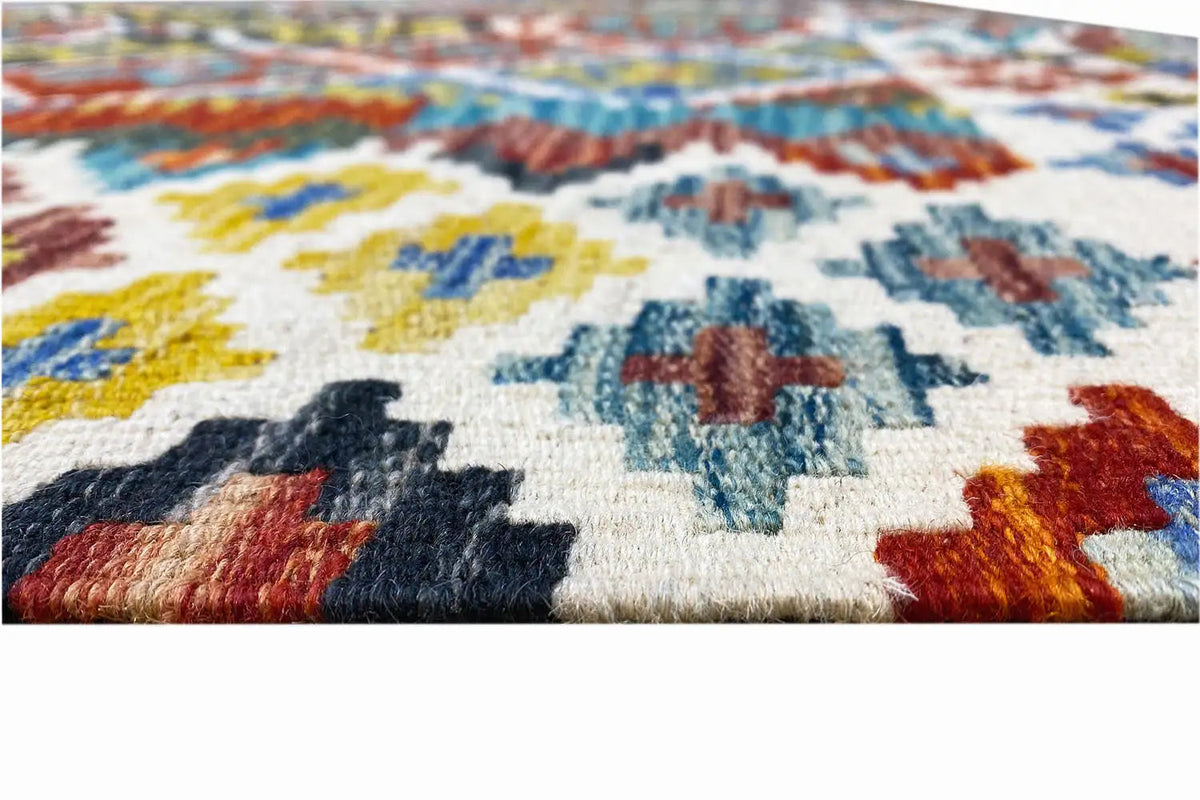 Kilim detail: woven pile texture with colorful geometric patterns