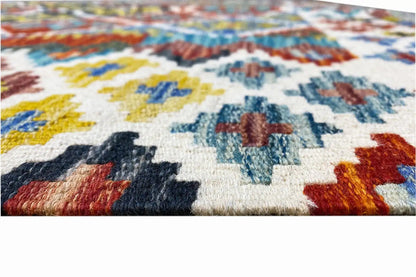 Kilim detail: woven pile texture with colorful geometric patterns