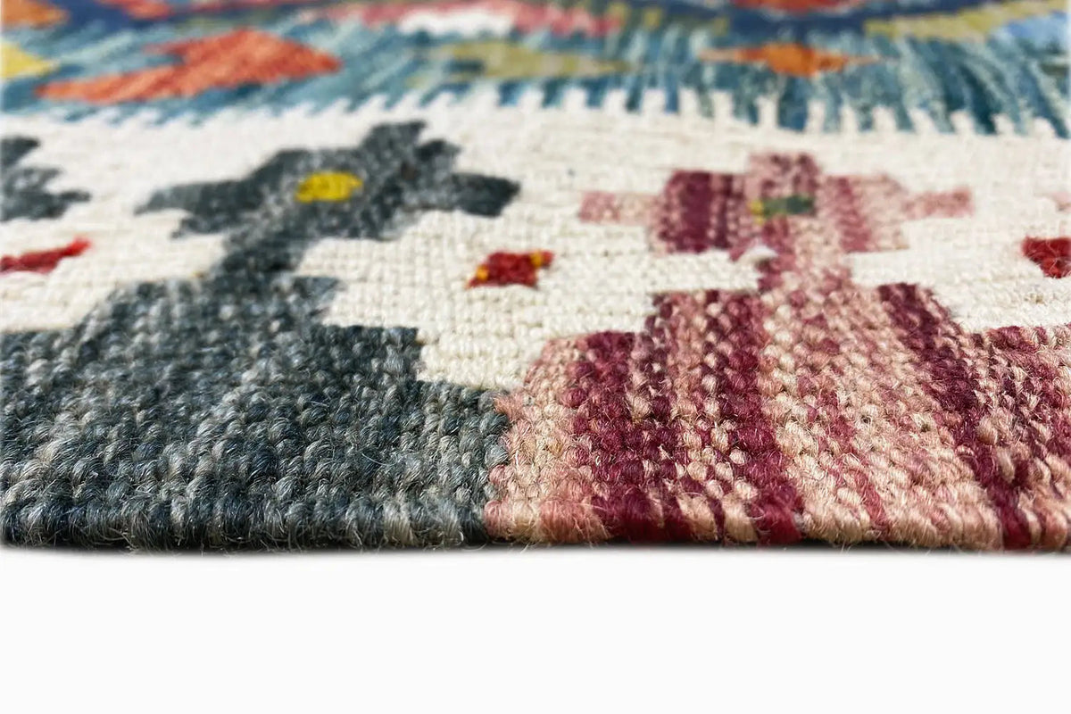 Kilim rug edge with colorful threads and a fine woven pattern