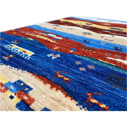 Gabbeh rug close-up: blue-red weave with landscape details, 90x59 cm