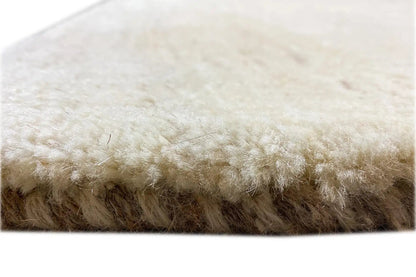 Gabbeh rug: side edge and pile, light beige, close-up