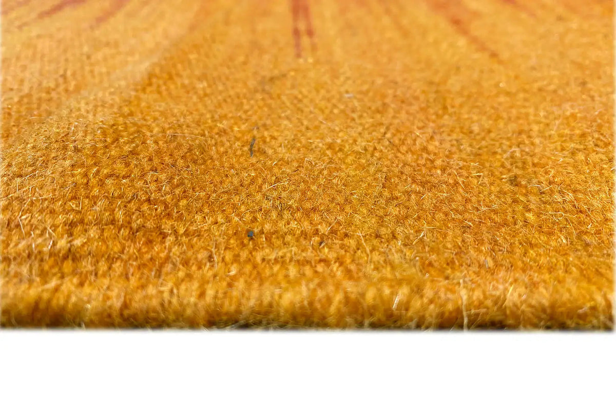 Yellow-orange kilim rug, detail of the pile fibers at the edge