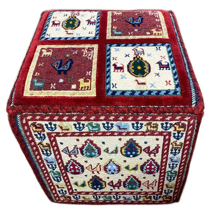 Soumak rug with colorful ornaments, red border, and four visible tiles.