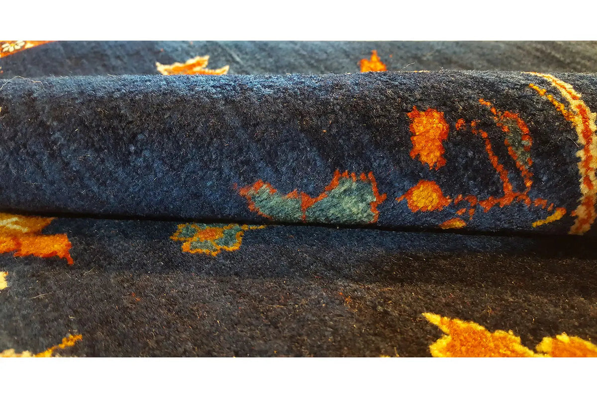 Carpet detail: dense pile with a blue base and orange accents