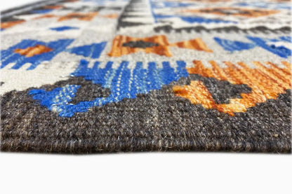 Afghan kilim rug edge with a dense weave and multicolored pile