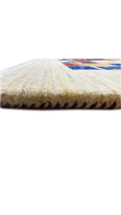 Gabbeh rug close-up of the creamy pile height with fringe