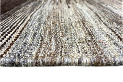 Kilim Qashqai rug close-up: fine pile and fringes, predominantly gray with dark lines