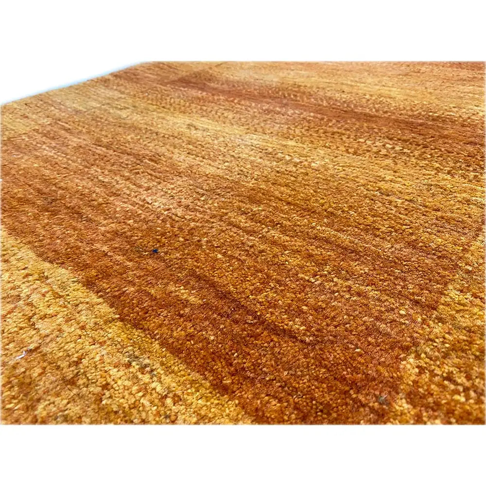 Gabbeh Lori rug, detail of the orange-brown wool surface