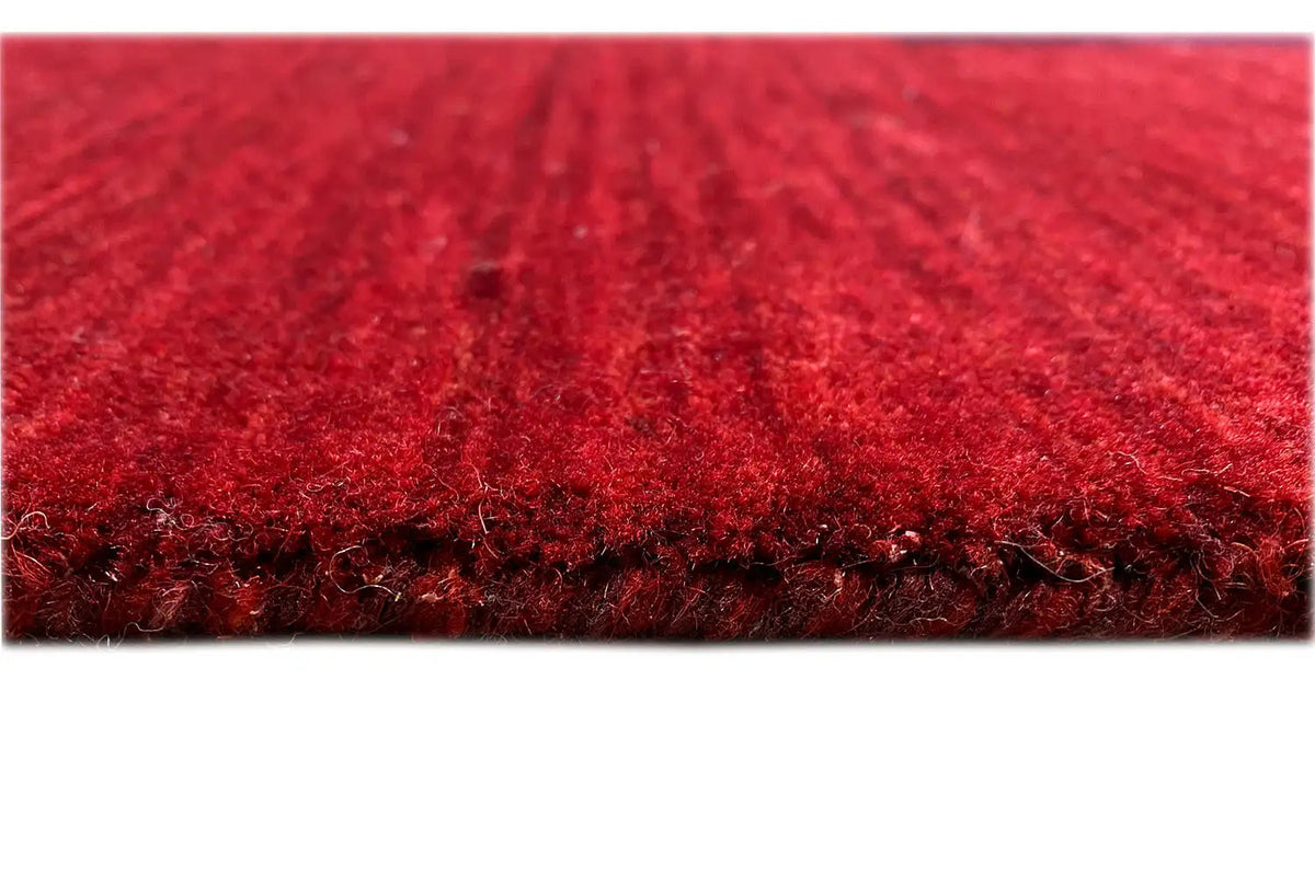 Gabbeh rug detail: dense red pile, 242×172 cm