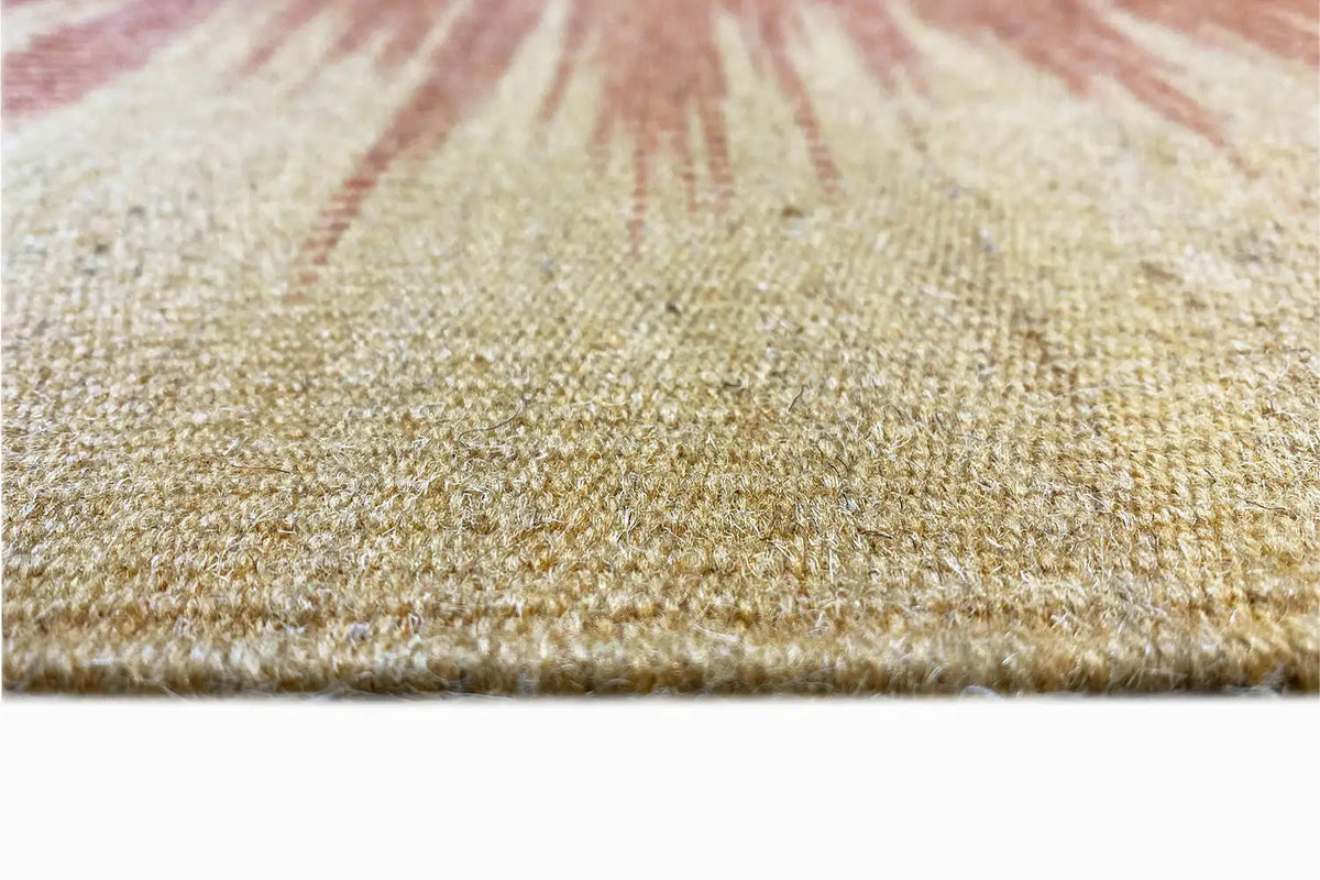 Kilim rug surface detail in beige with yellow-orange pattern traces