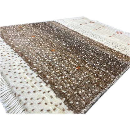 Gabbeh rug 58x43 cm, close-up: dense brown pattern with light dots and accents