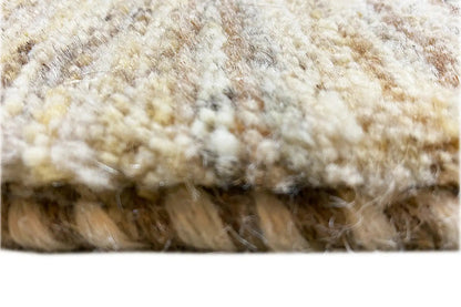 Close-up of the carpet pile with a dense, beige and brownish loop construction