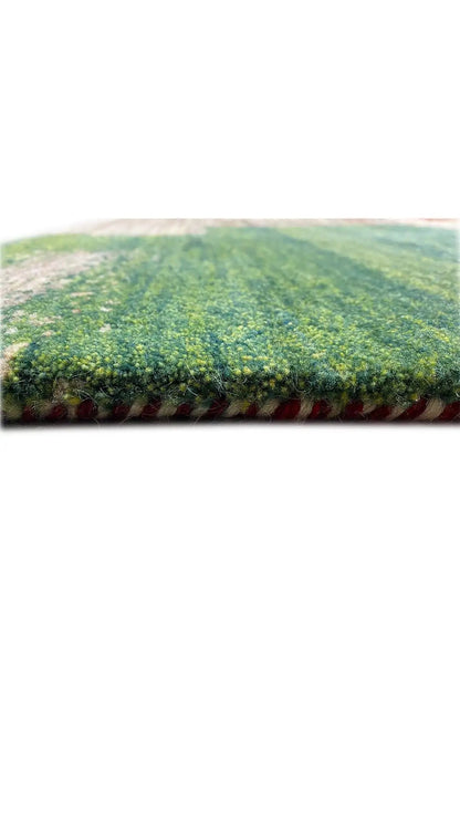 Gabbeh rug with an even green pile and colorful decorative border