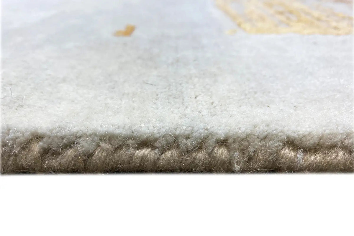 Rug edge with short pile on a light background, slightly frayed