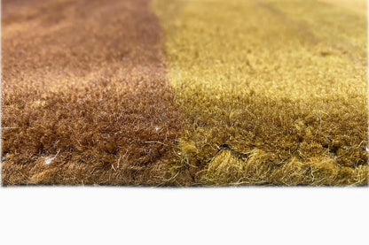 Hand-tufted rug 150x200 cm, detail of the pile texture in brown and green-yellow