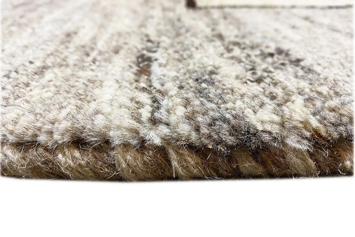 Carpet pile detail: dense beige-gray looped fabric with a visible edge seam