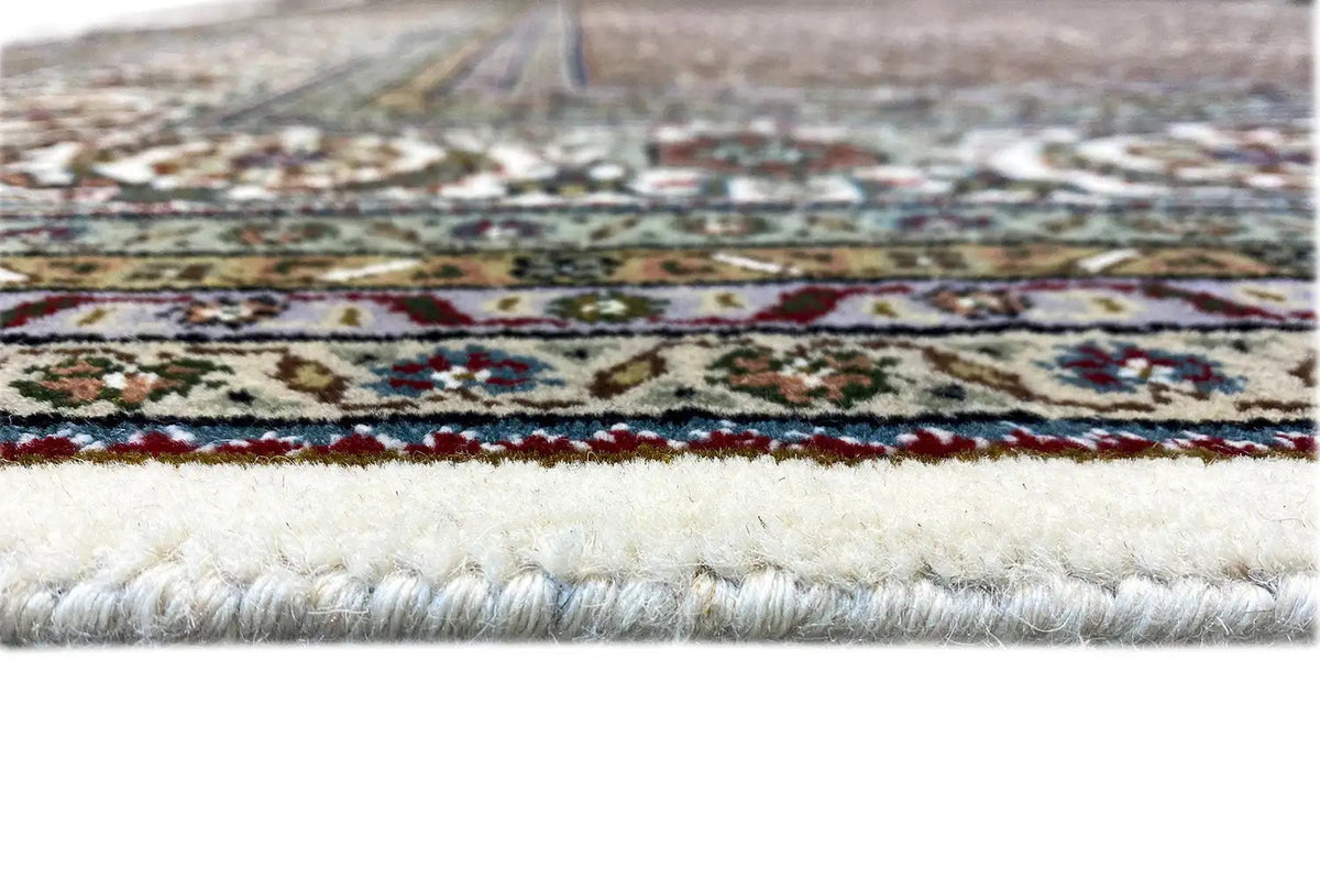 Carpet border with multicolored ornaments and short fringes, cream-colored pile edge