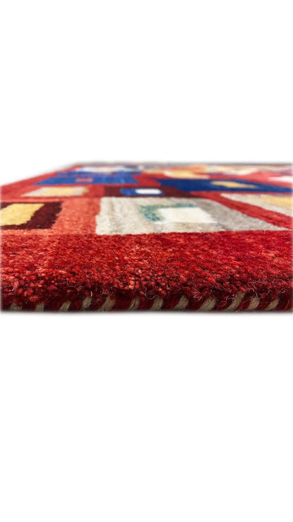 Gabbeh rug front edge in detail, red-blue pattern and pile