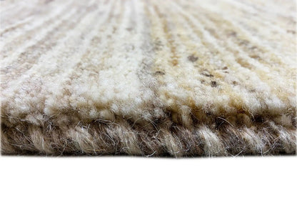Gabbeh rug detail at the edge: light pile with darker areas, thick border