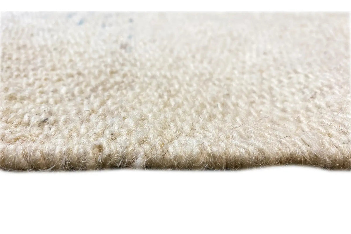 Kelim dhurrie rug detail of the light pile surface at the edge, soft and dense