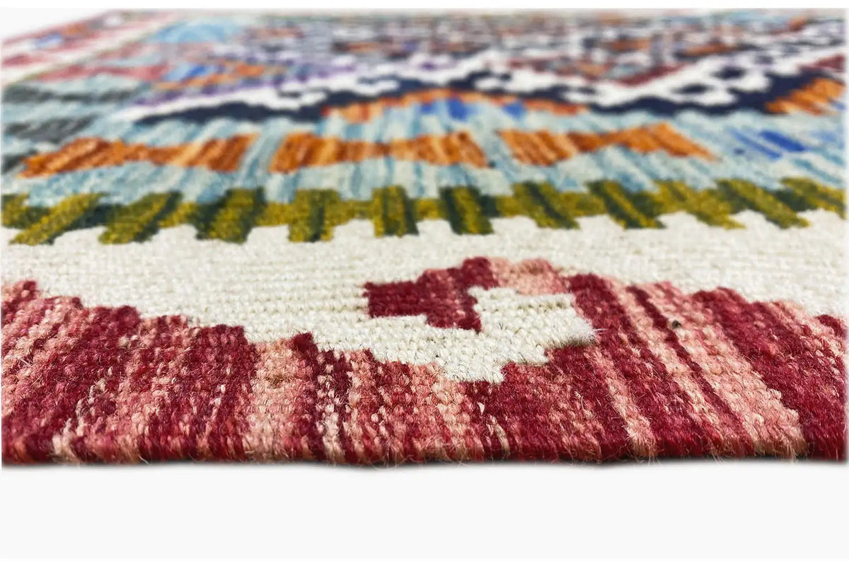 Close-up: kilim runner with fringed edge and colorful diamond pattern