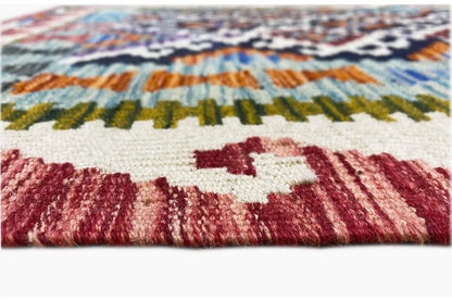 Close-up: kilim runner with fringed edge and colorful diamond pattern