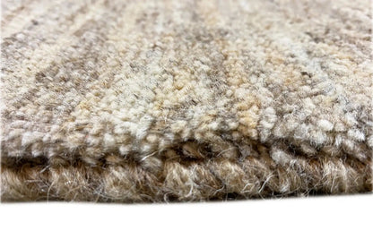 Gabbeh rug with a dense pile in beige and gray, detail of the texture