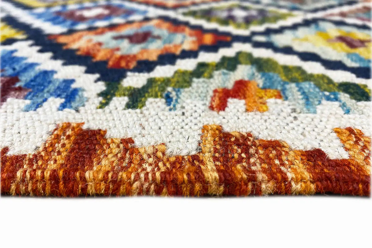 Kelim runner with a colored selvedge and dense pile, with fringes at the edge