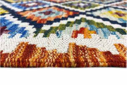 Kelim runner with a colored selvedge and dense pile, with fringes at the edge