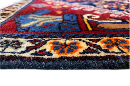 Close-up: patterned carpet edge with frayed edges and dense pile