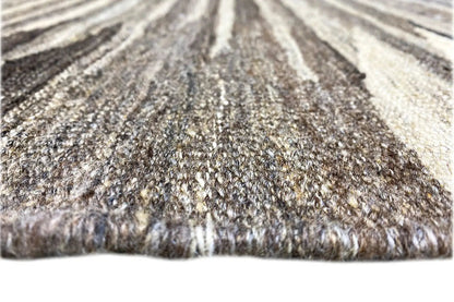 Close-up of a kilim rug with pile and a contrasting fringed edge