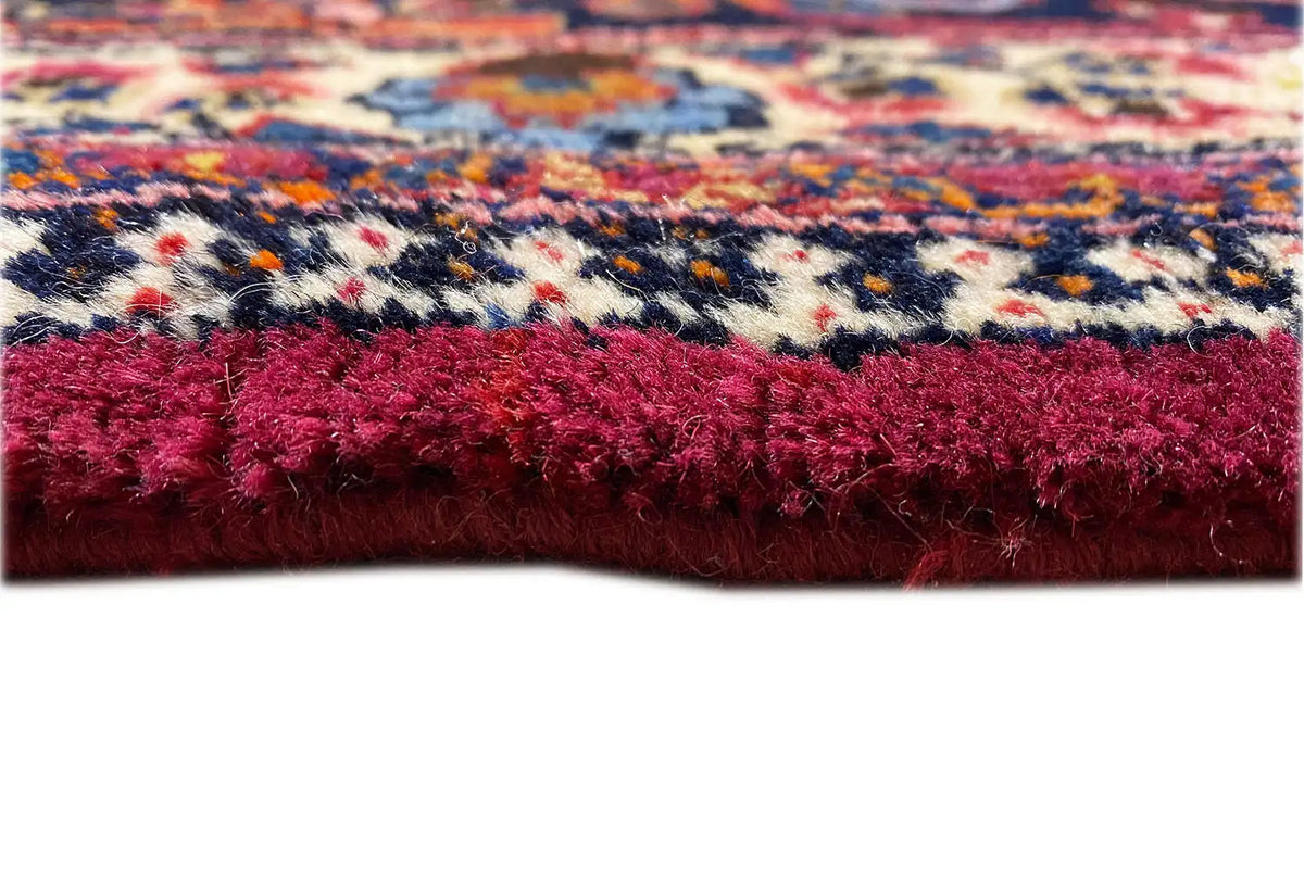 Carpet detail: red pile and multicolored border