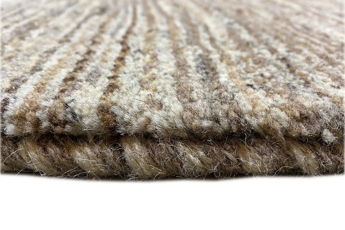 Gabbeh rug with a visible pile height and mottled patterns along the edge