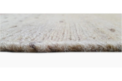 Kilim rug detail: fine beige texture with a short pile and woven edge