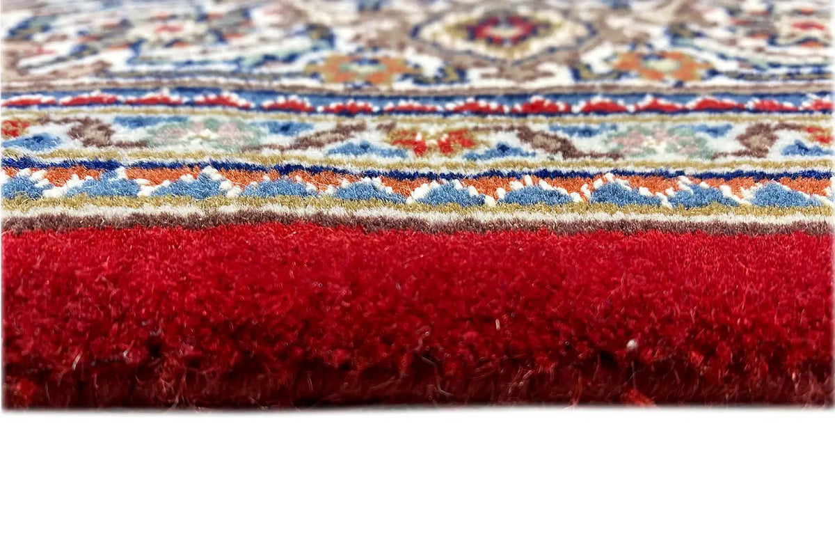 Rug 186x123 cm Detail: red pile fringe with a blue-and-white patterned border