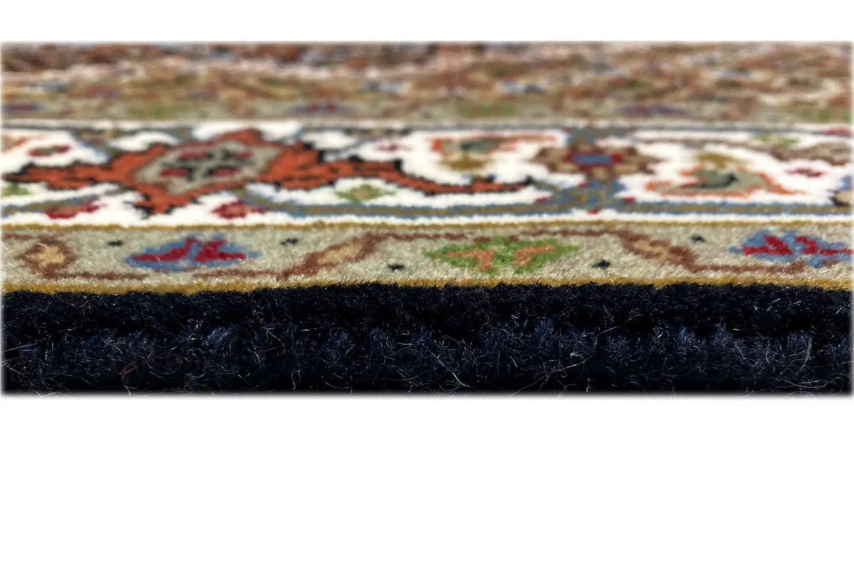 Indo Tabriz rug detail at the edge: multicolored border and pile height