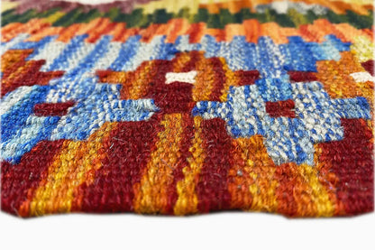 Afghan kilim runner detail: colorful woven rug with an integrated border