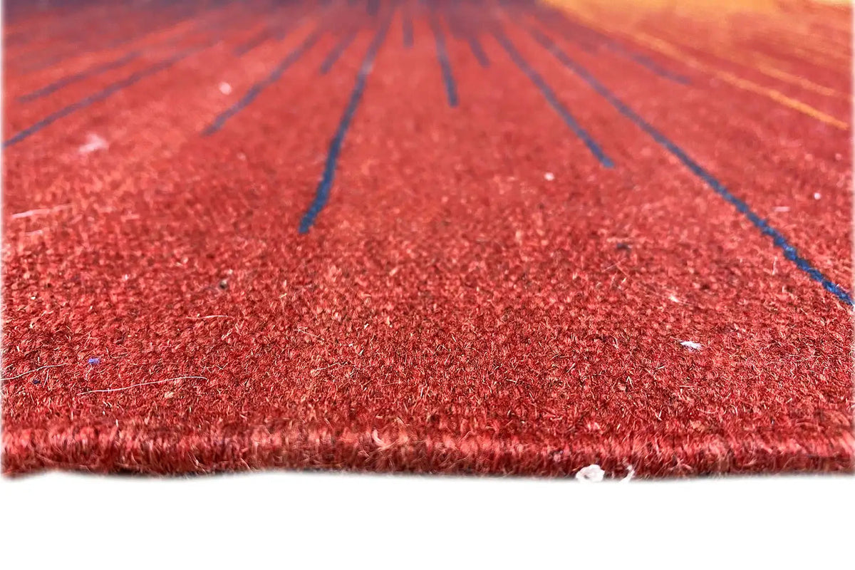 Detailed view: kilim rug with a red pile and blue lines, fine fringed edge