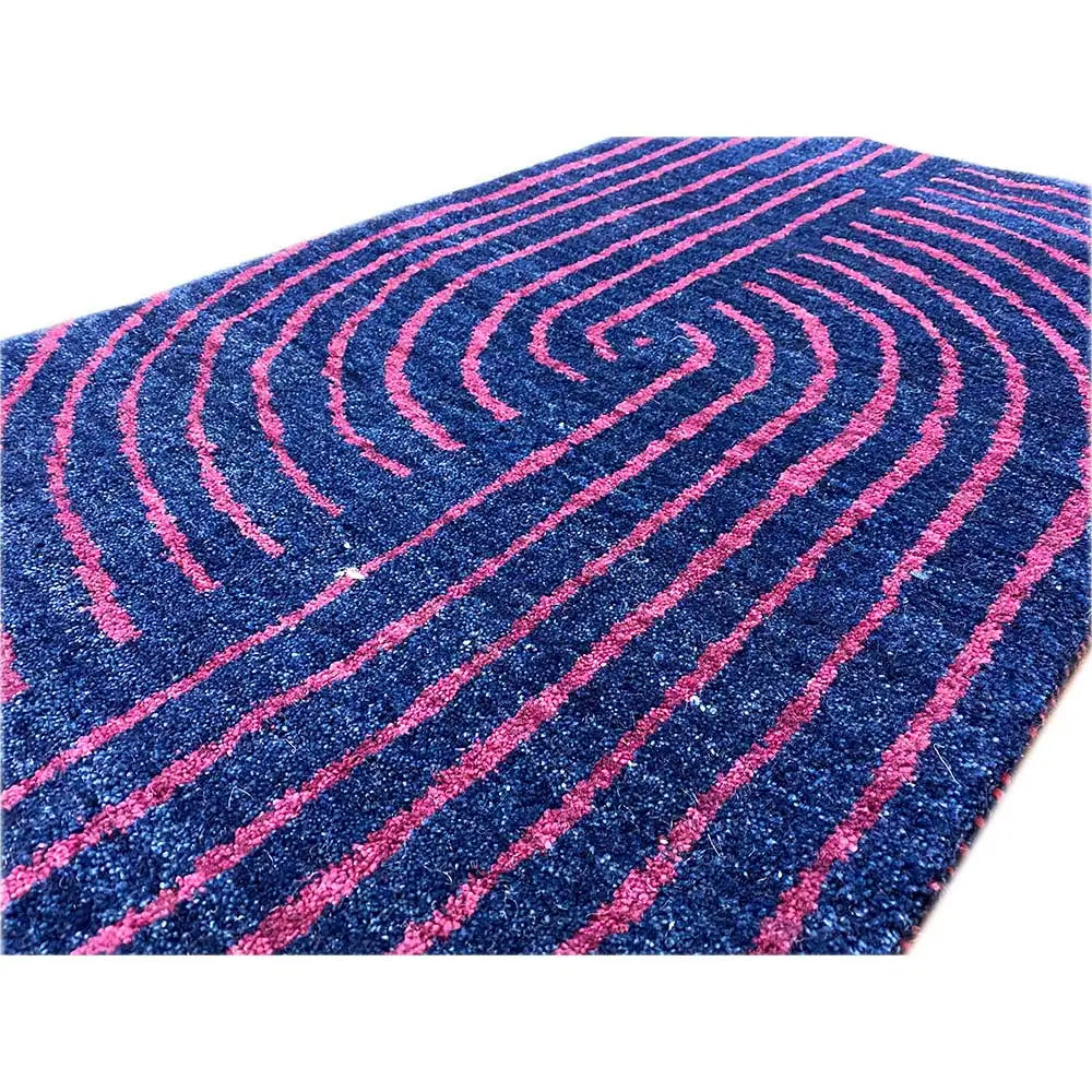 Gabbeh rug: close-up of the curved lines in dark blue and pink