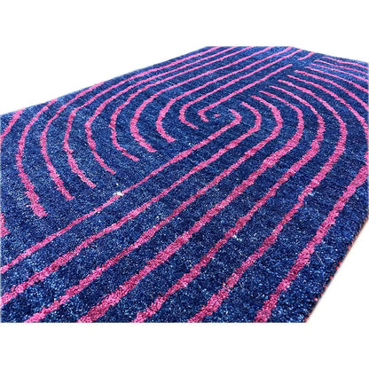 Gabbeh rug: close-up of the curved lines in dark blue and pink