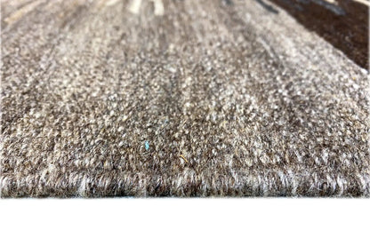 Kilim rug detail: woven pile with fringes, gray-beige and dark threads