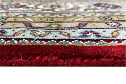 Indo Täbriz rug detail below: red pile, woven edge and fringes
