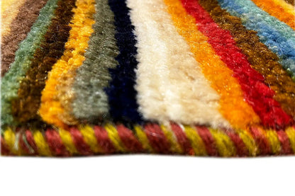 Gabbeh-Lori rug: close-up of colorful stripes, dense pile, fringes