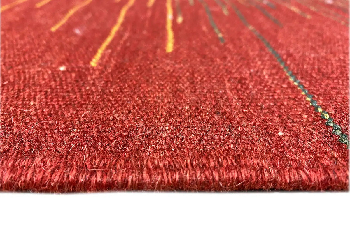 Kilim rug close-up: red pile with fine fiber textures and green accents