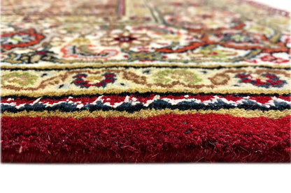 Indo Tabriz rug close-up: colorful ornamental border, dense pile