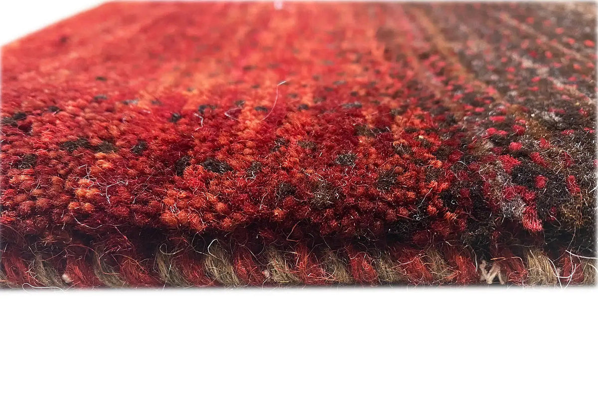 Gabbeh rug, close-up of the pile and edge with red and beige fibers