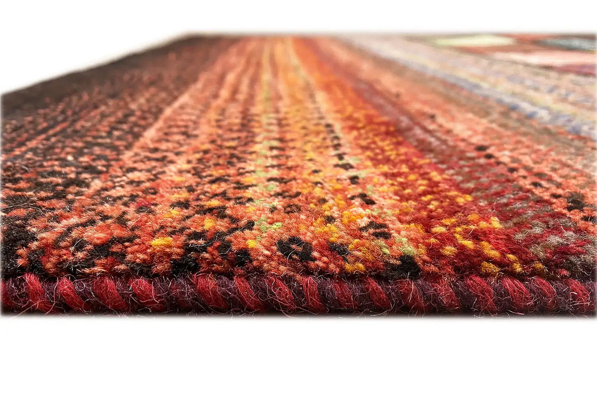 Gabbeh Lori rug, detail of the pile surface and fringes along the edge