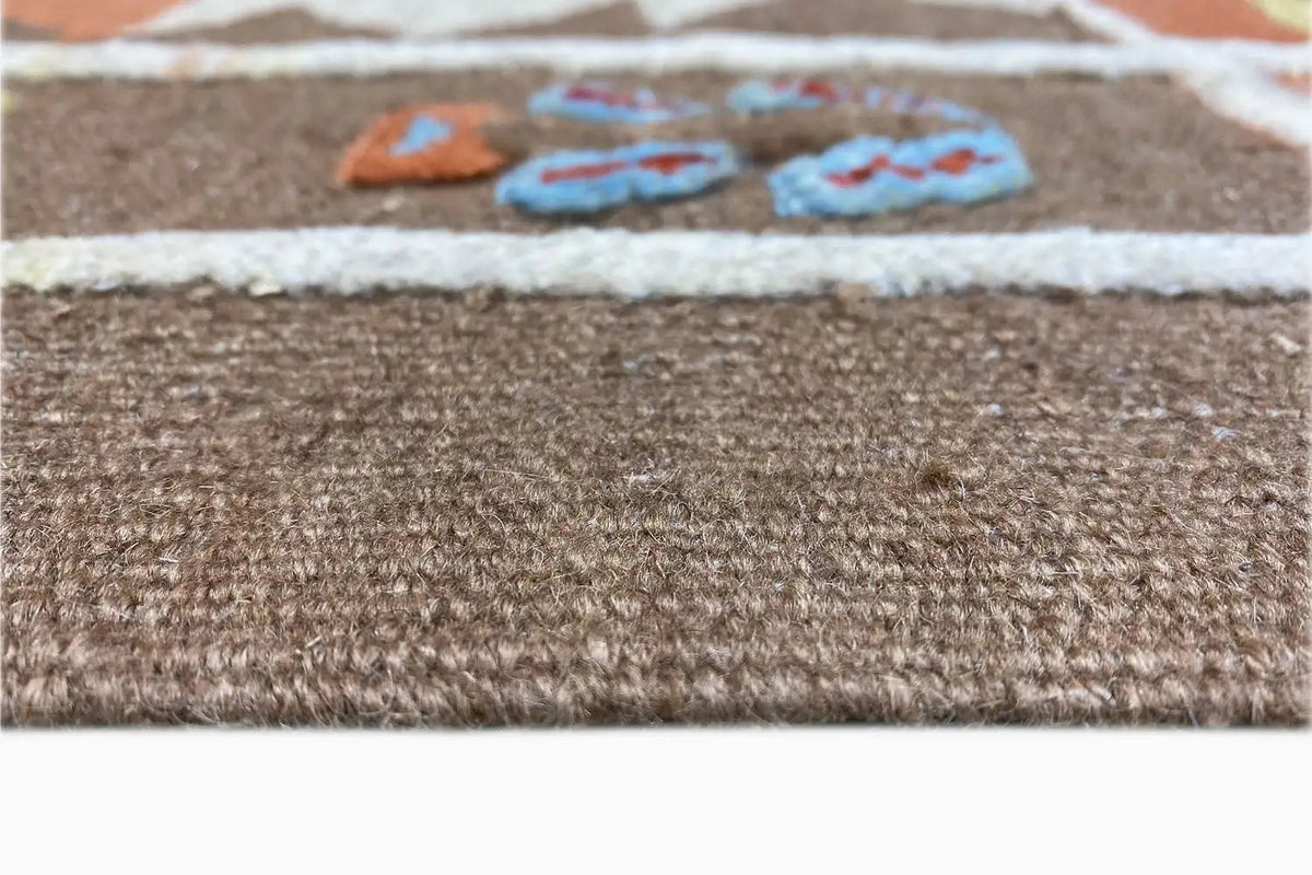 Kilim rug border with a fine woven texture and short fringes, brown and off-white