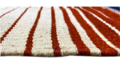 Close-up: Kilim with red and white stripes on a beige background, short fringes