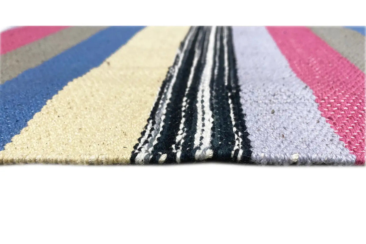 Close-up: Kilim dhurrie with multicolored stripes, woven edge and fringes